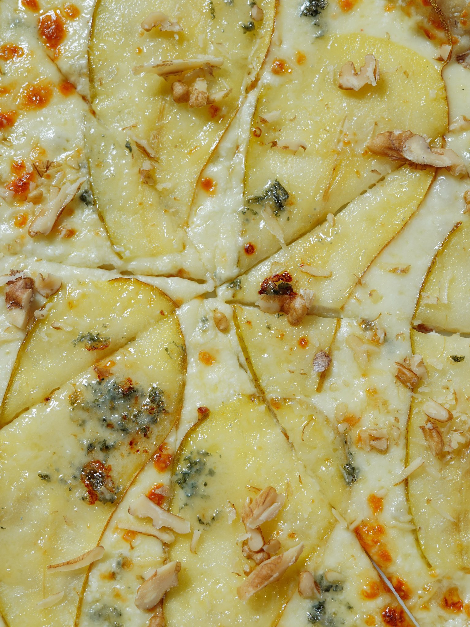 Cheese and herbs pizza closeup, 8 slices