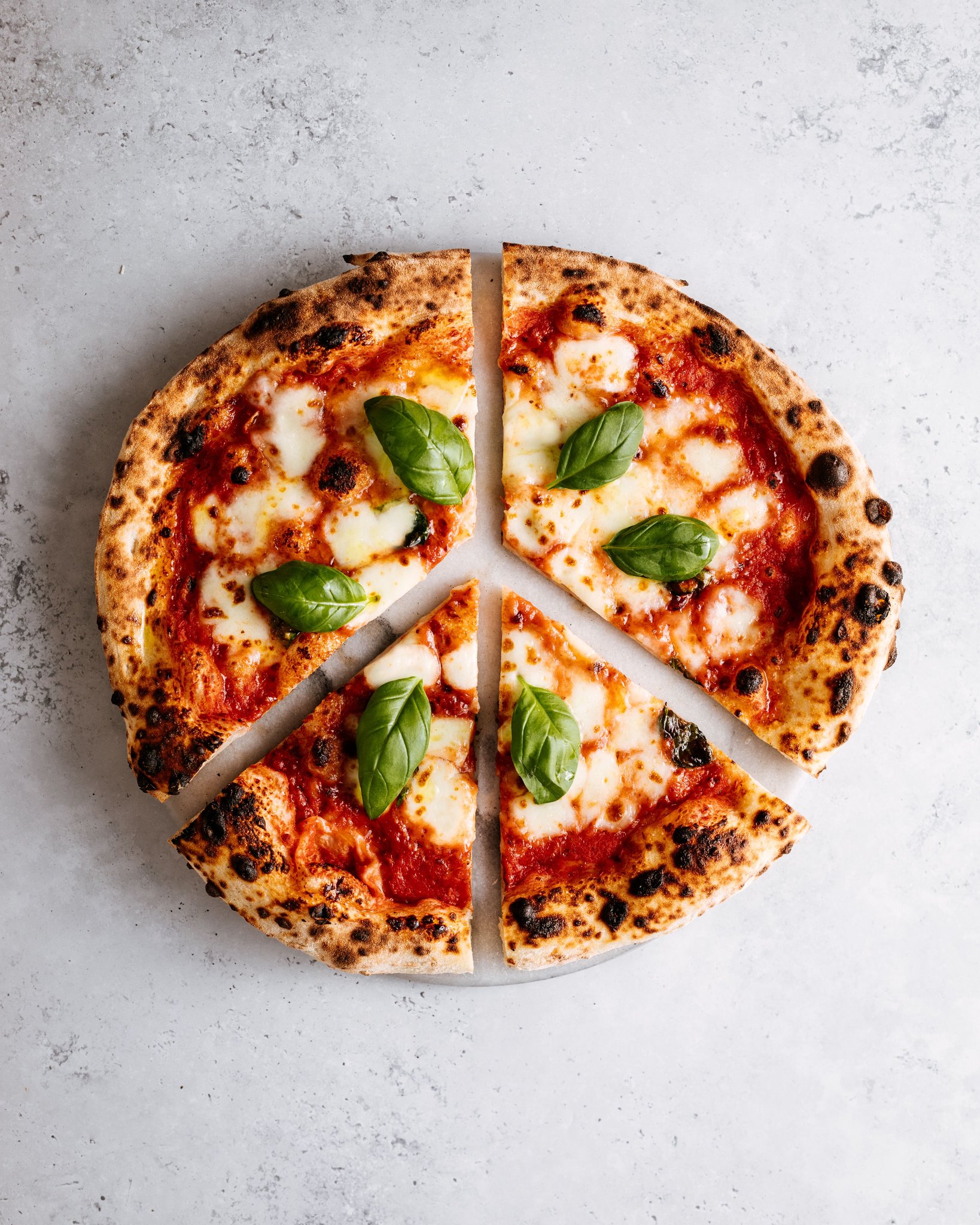 Classic cut margherita pizza in 8 slices